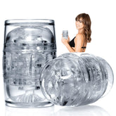 A woman with long brown hair in black lingerie is holding and smiling at a transparent cylindrical Fleshlight Quickshot Riley Reid Open-Ended Masturbation Sleeve, showcasing its intricate internal textures. Another identical Fleshlight product is displayed both standing and lying horizontally.